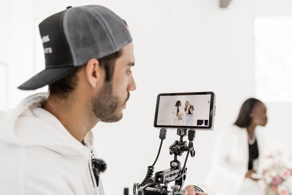 Woman being recorded from a videographer