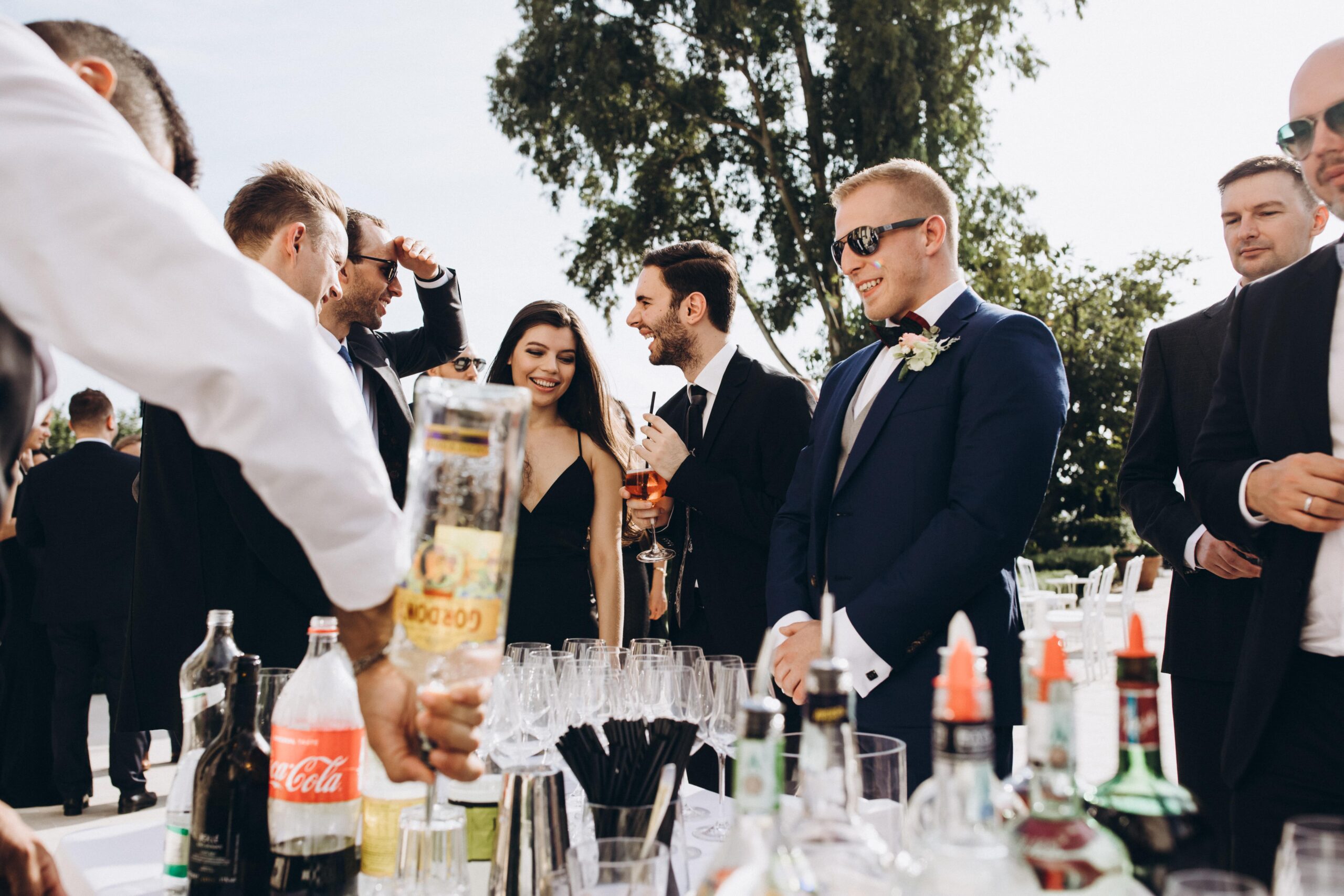Photo of wedding guests at beverage table